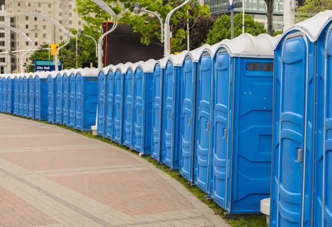 multiple portable restrooms in a neat and tidy row in Alameda